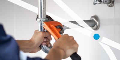 Plumber fixing sink drain