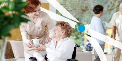 Nurse handing a senior woman coffee