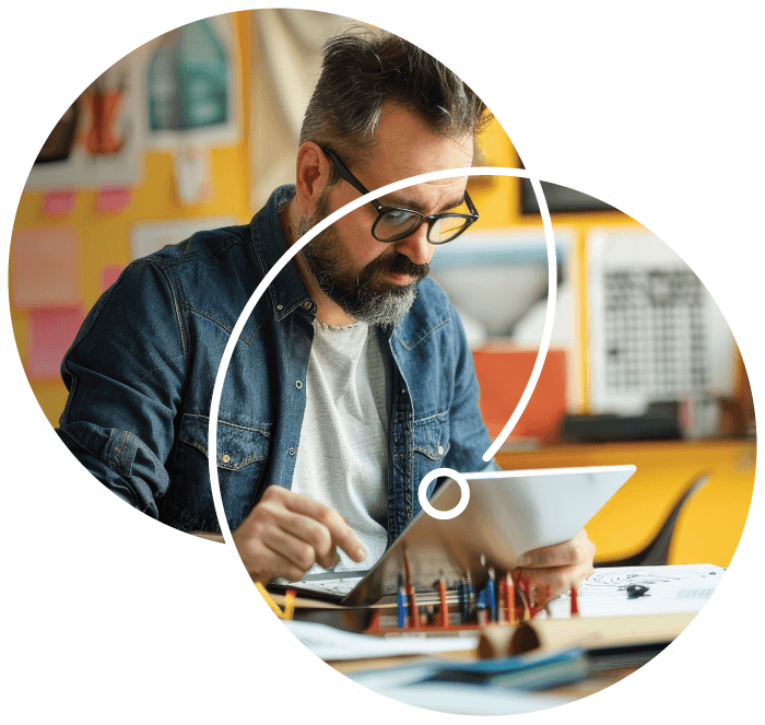 Man on laptop using Salesgenie Smart AI