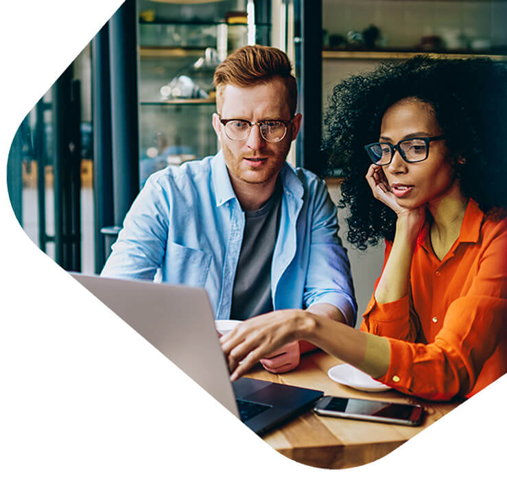 Co-workers working on laptop